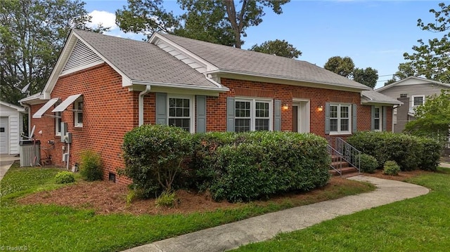 2206 Revolan Dr, Greensboro, NC 27407 - bungalow-style house featuring brick siding, a shingled roof, and a front lawn