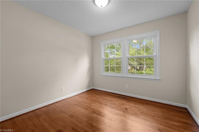 2206 Revolan Dr, Greensboro, NC 27407 - spare room featuring wood finished floors