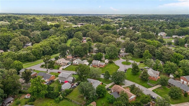 2206 Revolan Dr, Greensboro, NC 27407 - aerial view of property's location with nearby suburban area and a forest