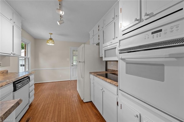 2206 Revolan Dr, Greensboro, NC 27407 - kitchen with white appliances, white cabinets, light wood-style floors, pendant lighting, and rail lighting
