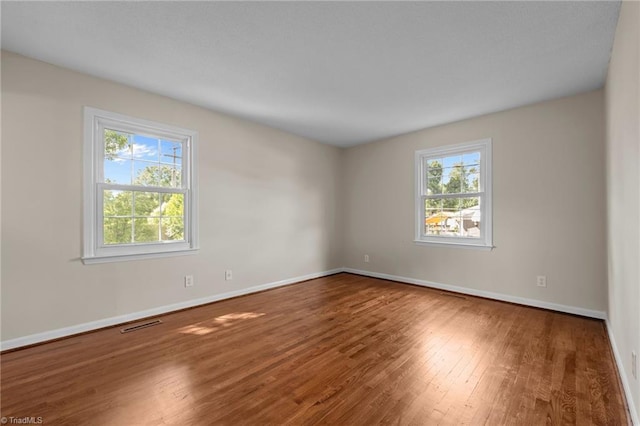 2206 Revolan Dr, Greensboro, NC 27407 - unfurnished room with wood finished floors and baseboards