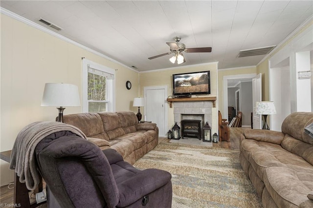 4724 Old Julian Rd, Julian, NC 27283 - living area featuring crown molding, ceiling fan, wood finished floors, and a fireplace