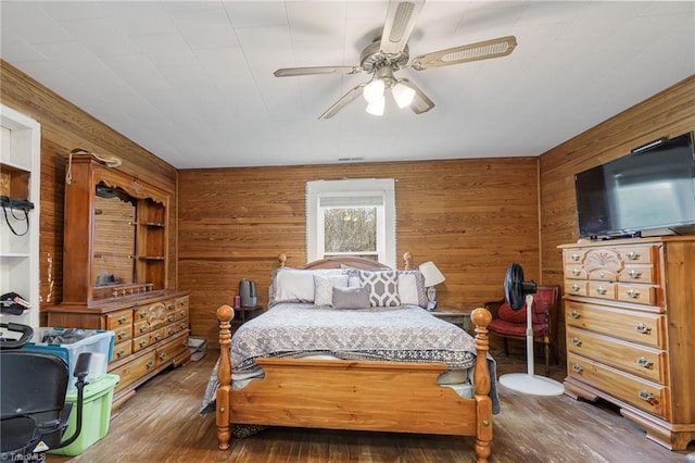 4724 Old Julian Rd, Julian, NC 27283 - bedroom featuring wooden walls, hardwood / wood-style floors, and ceiling fan