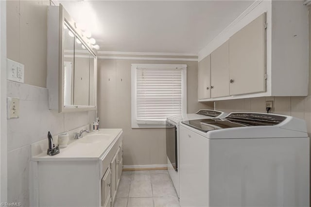 4724 Old Julian Rd, Julian, NC 27283 - laundry room featuring washer and clothes dryer, light tile patterned floors, and ornamental molding