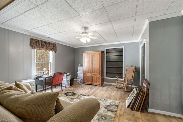 4724 Old Julian Rd, Julian, NC 27283 - living area featuring crown molding, light wood-style floors, and a ceiling fan