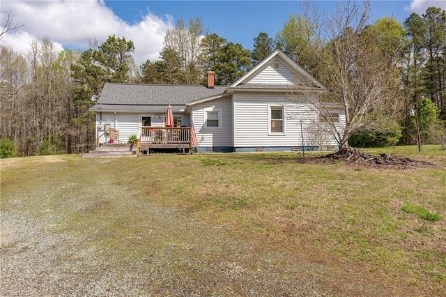 4724 Old Julian Rd, Julian, NC 27283 - view of front of home with a deck, a front yard, and a chimney