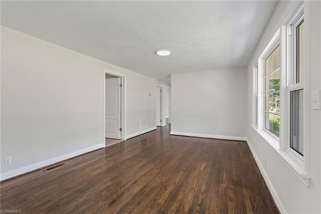 1616 Sanford Dr, Winston-Salem, NC 27105 - spare room with baseboards, wood finished floors, and visible vents