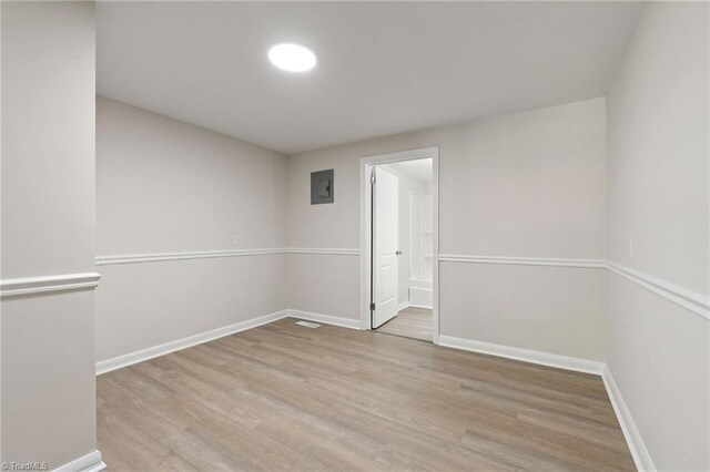 1616 Sanford Dr, Winston-Salem, NC 27105 - unfurnished room with baseboards and wood finished floors