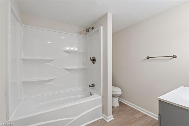 1616 Sanford Dr, Winston-Salem, NC 27105 - bathroom with wood finished floors, vanity, baseboards, toilet, and  shower combination