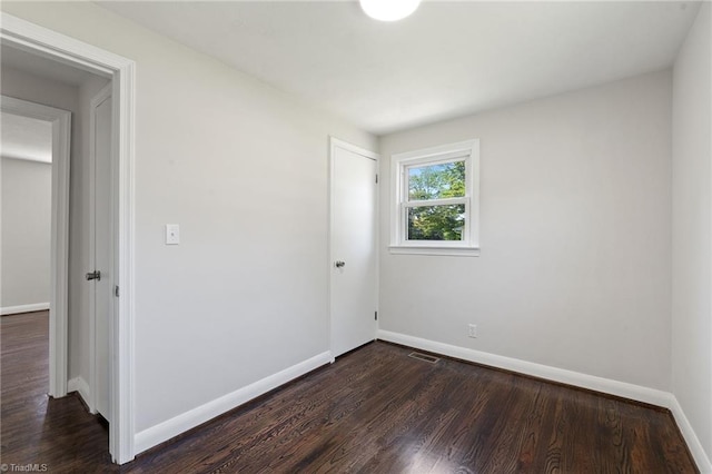 1616 Sanford Dr, Winston-Salem, NC 27105 - unfurnished room featuring baseboards, visible vents, and dark wood-style floors