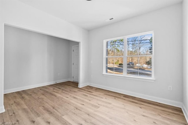 unfurnished room featuring light wood-type flooring