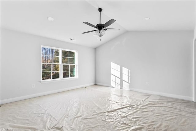 spare room featuring ceiling fan and lofted ceiling