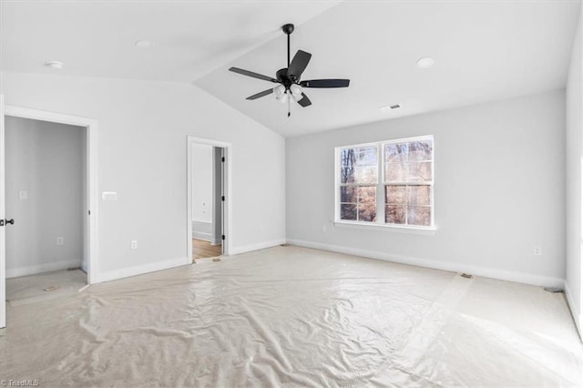 unfurnished bedroom with ceiling fan and vaulted ceiling