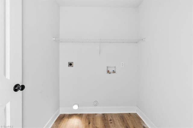 washroom with washer hookup, hookup for an electric dryer, and hardwood / wood-style floors