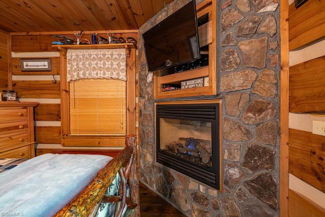 612 Joe Shoemaker Rd, Vilas, NC 28692 - bedroom featuring a fireplace, wooden ceiling, and wood walls