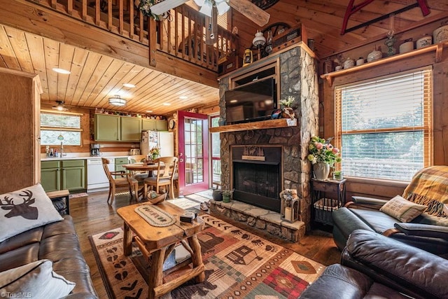 612 Joe Shoemaker Rd, Vilas, NC 28692 - living room with wooden ceiling, dark wood-style floors, a fireplace, ceiling fan, and wood walls