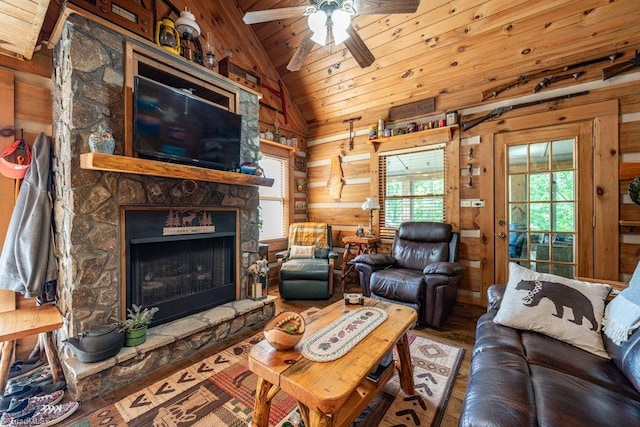 612 Joe Shoemaker Rd, Vilas, NC 28692 - living room with wooden ceiling, lofted ceiling, a stone fireplace, wooden walls, and a ceiling fan