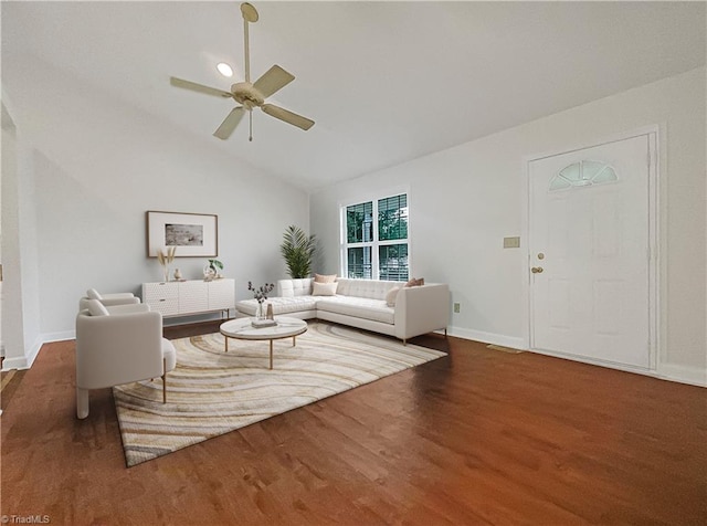 living room with vaulted ceiling, dark hardwood / wood-style flooring, and ceiling fan