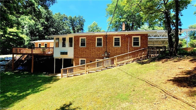 back of house featuring a wooden deck and a lawn