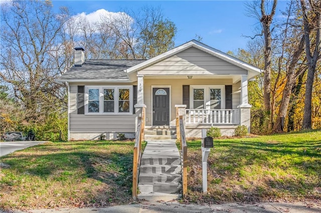 bungalow featuring a front yard and a porch