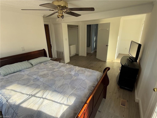 bedroom with ceiling fan, a closet, and light wood-type flooring