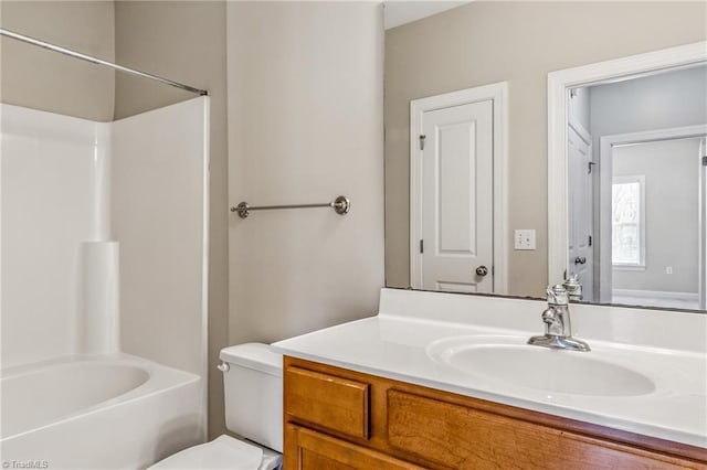 full bath featuring toilet,  shower combination, and vanity