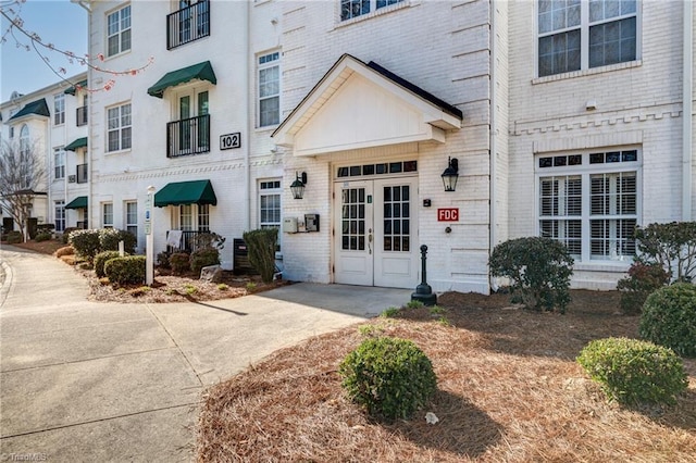 entrance to property with brick siding