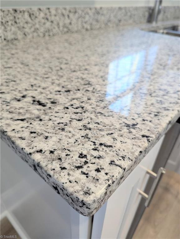 room details featuring light stone countertops