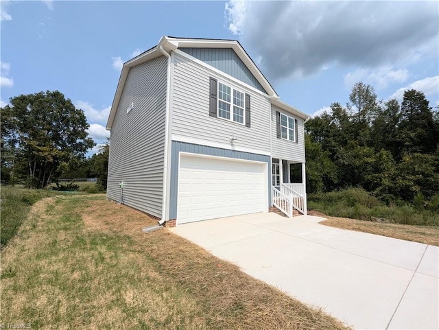 view of front of house with a garage and a front yard