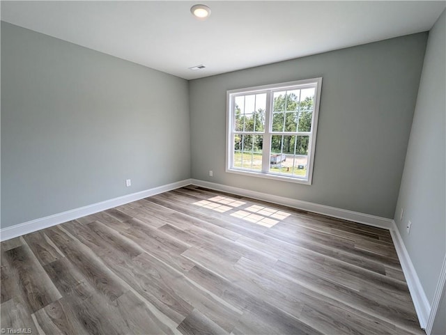 empty room featuring hardwood / wood-style floors