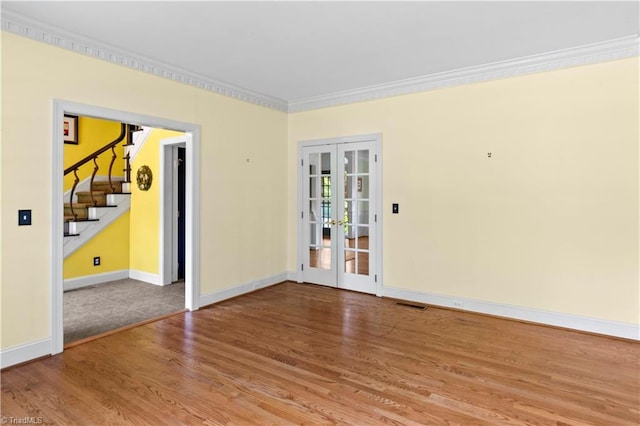 1420 Thornhill Ln, Winston-Salem, NC 27106 - spare room with french doors, crown molding, wood finished floors, and stairs