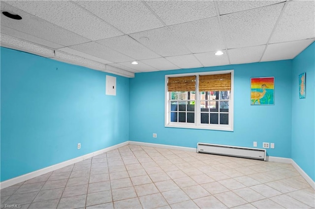 1420 Thornhill Ln, Winston-Salem, NC 27106 - unfurnished room with a baseboard heating unit, a paneled ceiling, recessed lighting, and tile patterned floors