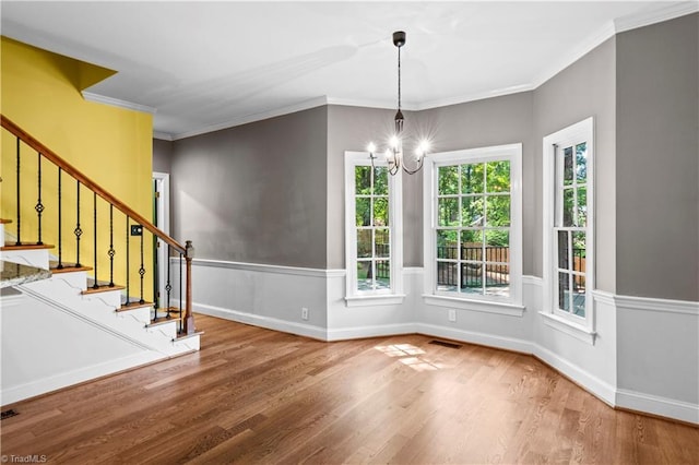 1420 Thornhill Ln, Winston-Salem, NC 27106 - unfurnished dining area with stairs, wood finished floors, a chandelier, and ornamental molding
