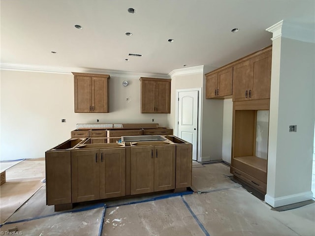 300 Redland Rd, Advance, NC 27006 - kitchen with ornamental molding, a kitchen island, and brown cabinets
