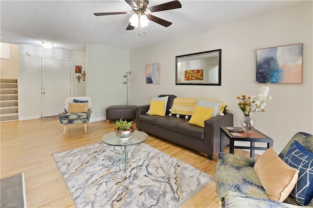 2429 Cypress Ct, High Point, NC 27265 - living area with stairway, wood finished floors, a textured ceiling, and a ceiling fan
