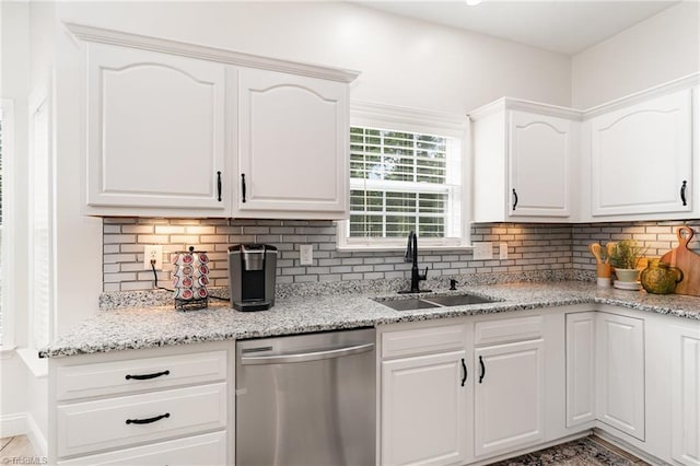 4636 Shattalon Cir, Winston-Salem, NC 27106 - kitchen featuring stainless steel dishwasher, a sink, tasteful backsplash, and white cabinets