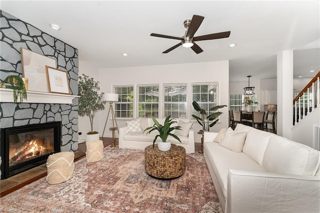4636 Shattalon Cir, Winston-Salem, NC 27106 - living room with a ceiling fan, a stone fireplace, recessed lighting, and stairs