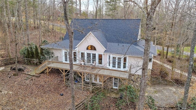 rear view of property with a wooden deck