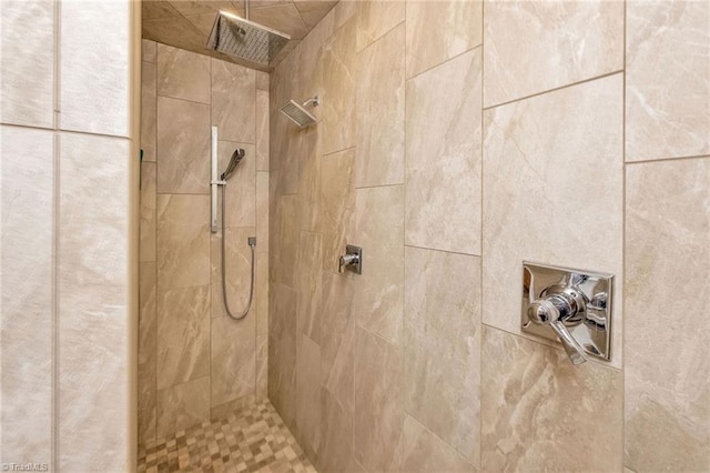 bathroom with a tile shower