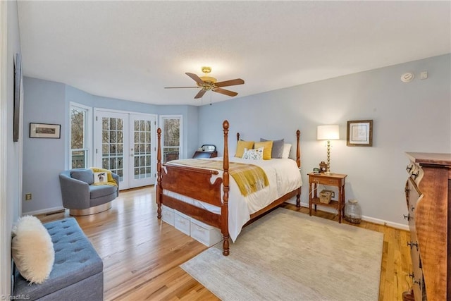 bedroom with french doors, ceiling fan, light hardwood / wood-style floors, and access to outside