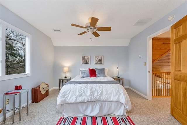 carpeted bedroom featuring lofted ceiling and ceiling fan