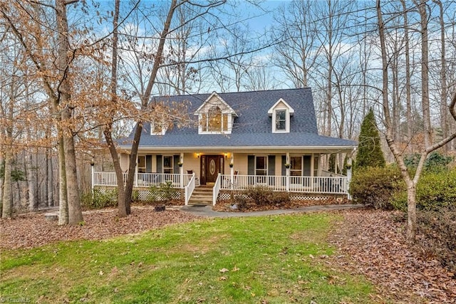 view of front of house with a front yard and covered porch