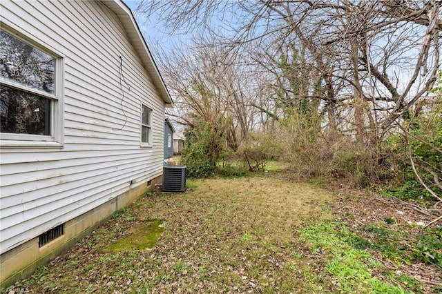 view of yard with central air condition unit