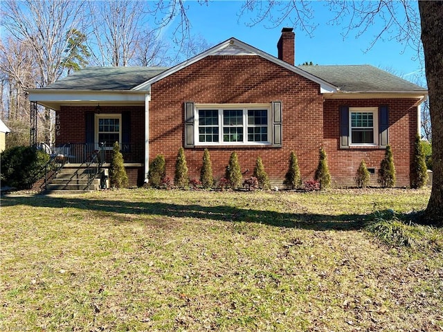 view of front of property with covered porch and a front yard