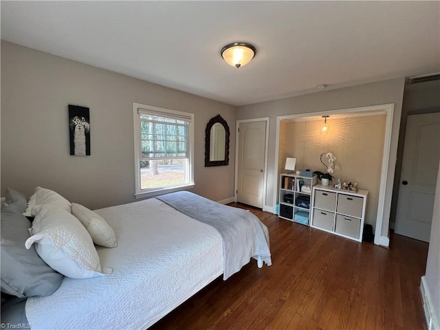 bedroom featuring dark wood-type flooring