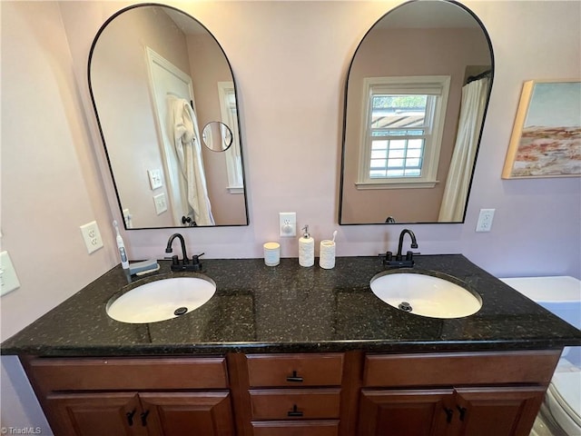 bathroom with vanity and toilet