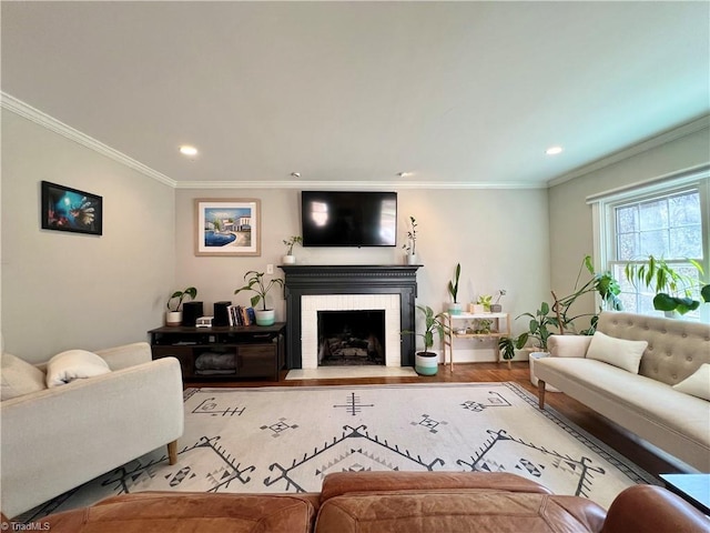 living room featuring crown molding and hardwood / wood-style flooring