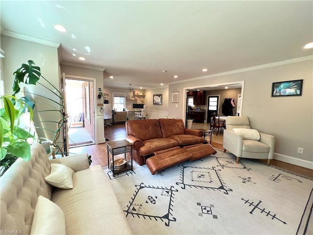 living room featuring hardwood / wood-style flooring and ornamental molding