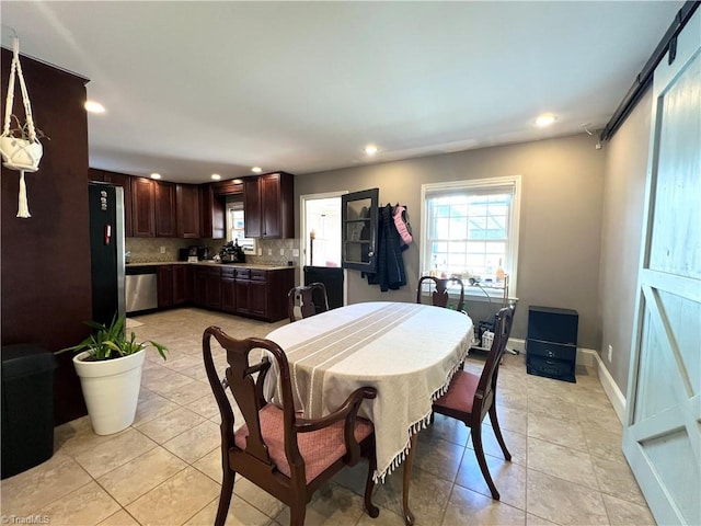 dining area featuring light tile patterned floors