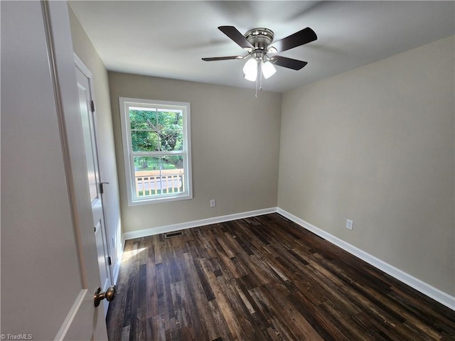 402 High Point St, Randleman, NC 27317 - spare room featuring dark wood finished floors, baseboards, and a ceiling fan